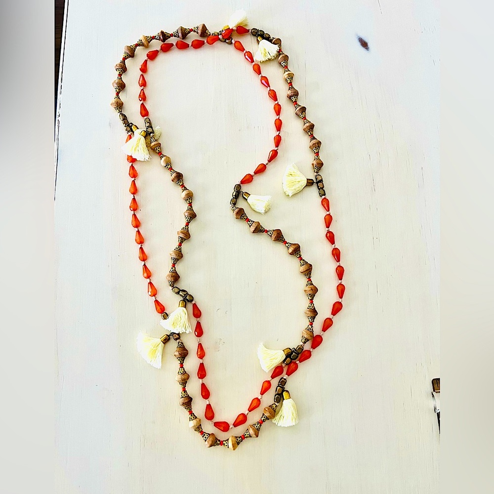 72” necklace of wood, orange faceted glass, brass, and tassels